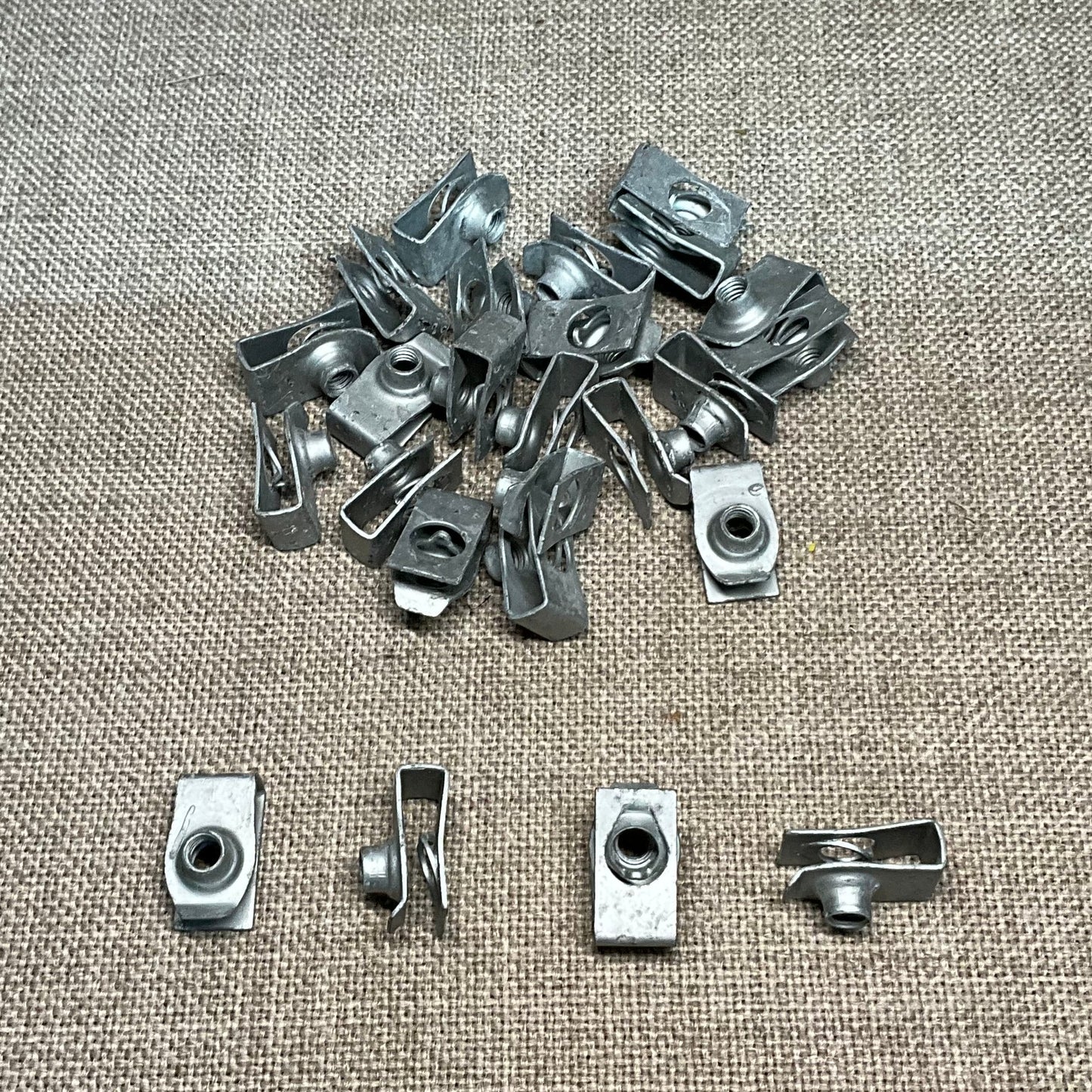 25-Auveco 12666 Extruded "U" Nuts (Foldover Nuts) GM: 11500663 Ford: N623344-S2